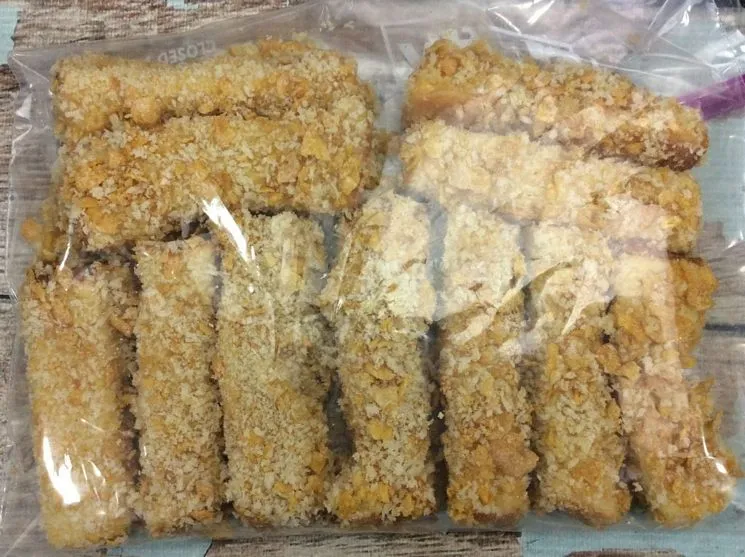 Frozen French Toast Sticks in Air Fryer in a bag on a wooden table