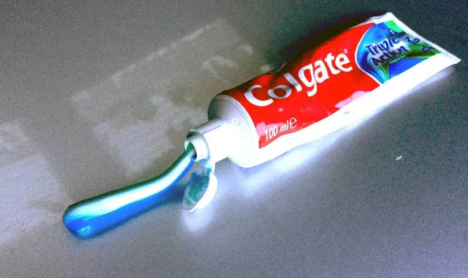 Colgate toothpaste on hood of car